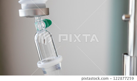 Close up medical intravenous IV drip in hospital background 122877259