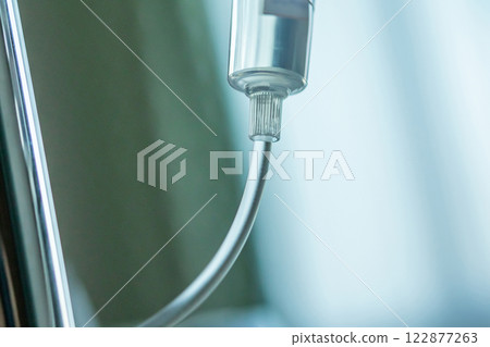 Close up medical intravenous IV drip in hospital background 122877263