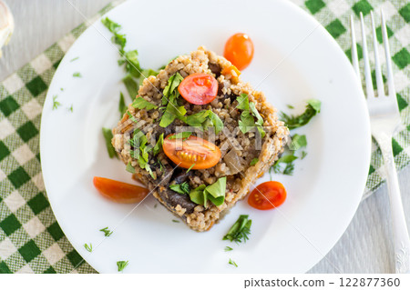 cooked bulgur with mushrooms and vegetables 122877360