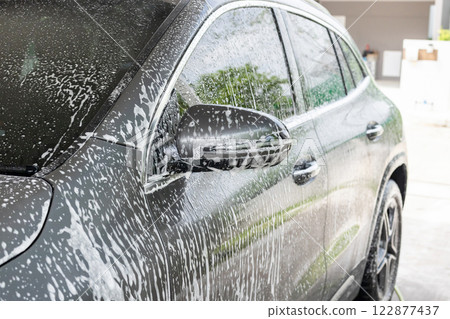 car cleaning and washing with foam soap 122877437
