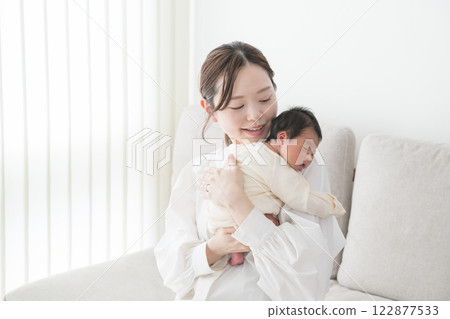 Baby hugged in Mama 122877533