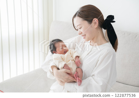 Baby hugged in Mama 122877536