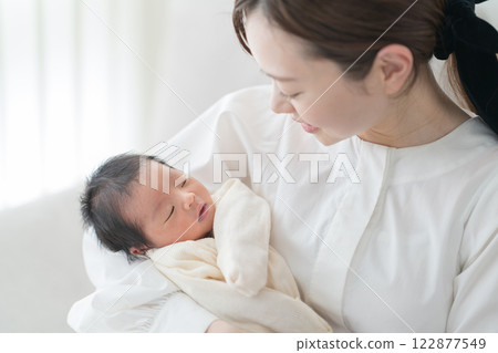 Baby hugged in Mama 122877549