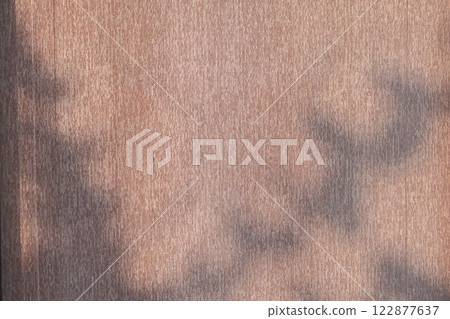 Abstract tree leaves shadow drop on brown curtain window background 122877637