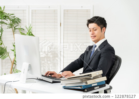 Businessman tired multitasking 122878127