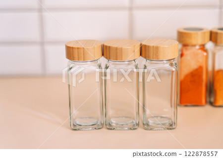 Empty set of glass jars for spices 122878557