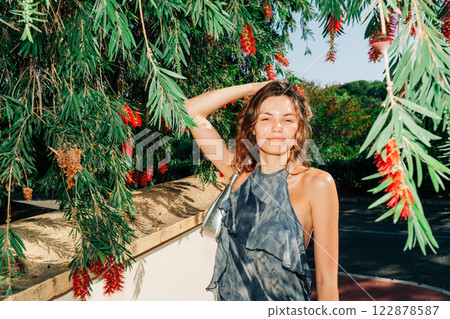 Nature meets fashion: a carefree summer moment, blending effortless beauty with botanical luxury and Nature meets fashion: a carefree summer moment, blending effortless beauty with botanical luxury and 122878587