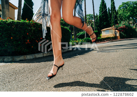 Cinematic movement: effortless fashion in motion, blending statement accessories with dynamic street Cinematic movement: effortless fashion in motion, blending statement accessories with dynamic street 122878602