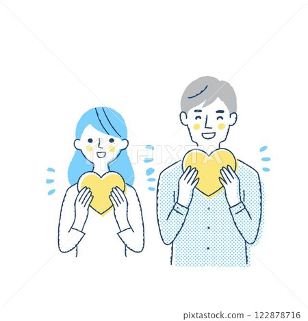 Smiling young couple holding a heart 122878716