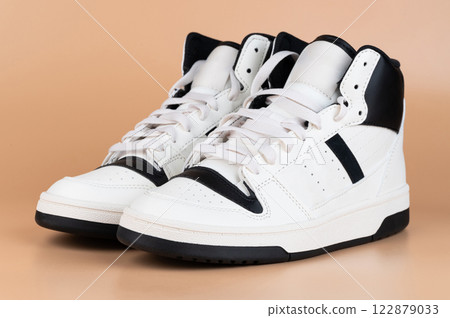 Sleek high-top sneakers designed with white and black color scheme Sleek high-top sneakers designed with white and black color scheme 122879033