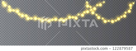 Festive Christmas light glowing garland string on dark background. Festive Christmas light glowing garland string on dark background. 122879587