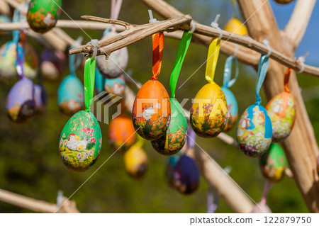 Easter eggs hanging on a branch Easter eggs hanging on a branch 122879750