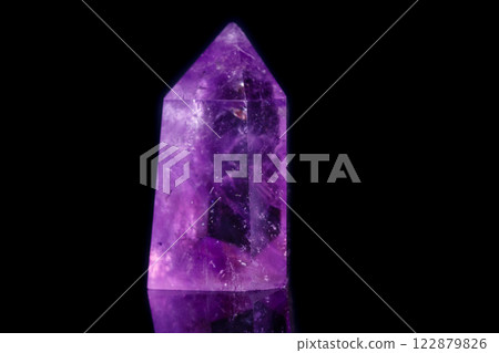 Macro mineral stone Amethyst crystal on a black background 122879826