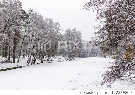 Winter lake covered with ice and snow 122879869