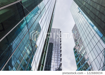 Glass Skyscrapers Reflecting the Urban Skyline in a Modern Financial District 122880034