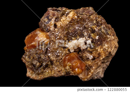 macro mineral stone Grossular, Garnet, Epidote on a black background 122880055
