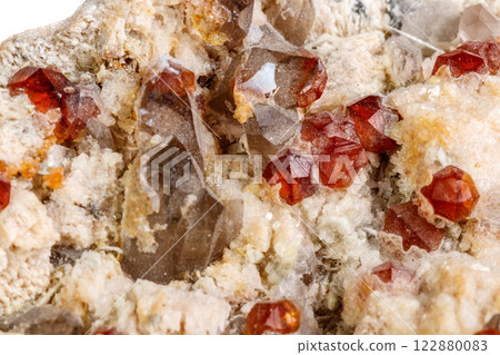 Macro mineral stone Spessartine, Feldspar, Smoky quartz, on a white background Macro mineral stone Spessartine, Feldspar, Smoky quartz, on a white background 122880083