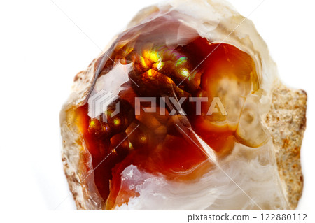 Macro mineral stone fiery Agate on a white background Macro mineral stone fiery Agate on a white background 122880112