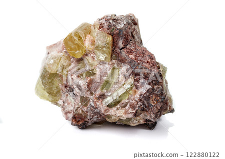 Macro mineral stoneGolden Apatite on a white background Macro mineral stoneGolden Apatite on a white background 122880122