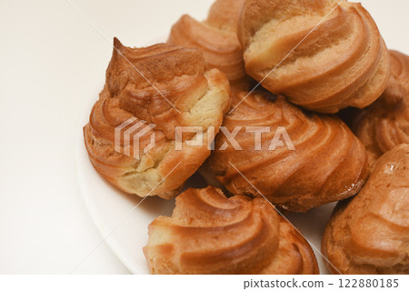 A custard pie. Eclair with cream. Delicious profiteroles. A custard pie. Eclair with cream. Delicious profiteroles. 122880185