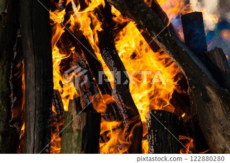 Beautiful fire flames on a campfire 122880280
