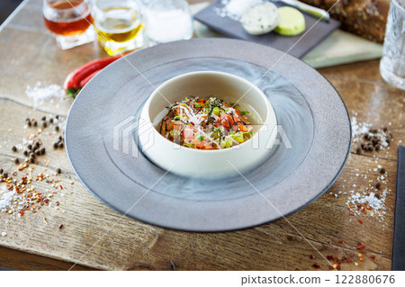 Tuna tartare. Ponzu sauce, chives, cucumber, masago and nori. Delicious healthy Italian traditional food closeup served for lunch in modern gourmet cuisine restaurant 122880676