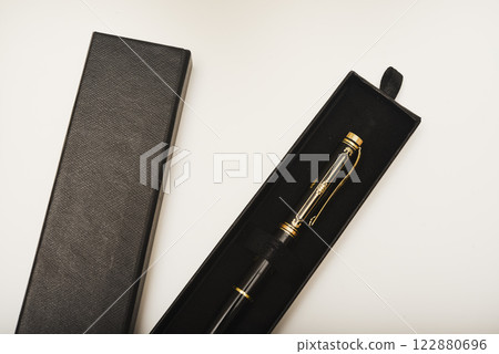 A gift pen in a box. A black fountain pen. A gift pen in a box. A black fountain pen. 122880696