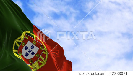 Portugal national flag waving in the wind on a clear day 122880711