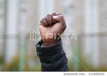 Raised black man fist in protest 122880920