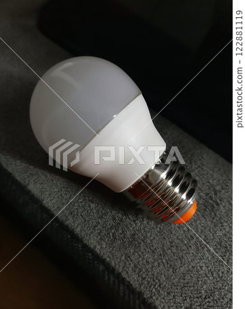 Light bulb on a gray background close-up 122881119