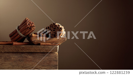 Cinnamon sticks on a old wooden table. Cinnamon sticks on a old wooden table. 122881239