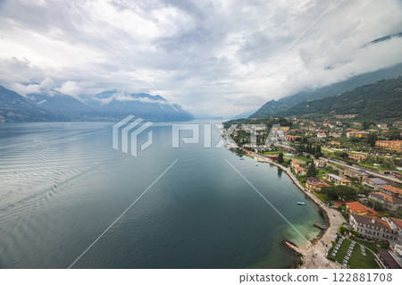 Lake Garda with mountains in background, view from Malcesine town on the eastern shore of the lake, Italy, Europe. Lake Garda with mountains in background, view from Malcesine town on the eastern shore of the lake, Italy, Europe. 122881708