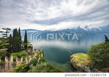 Lake Garda with mountains in background, view from Malcesine town on the eastern shore of the lake, Italy, Europe. 122881716