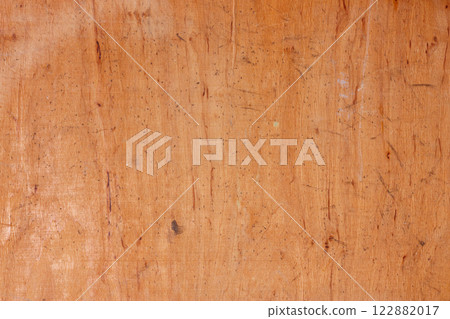 Close-up of a distressed wooden texture background. Close-up of a distressed wooden texture background. 122882017