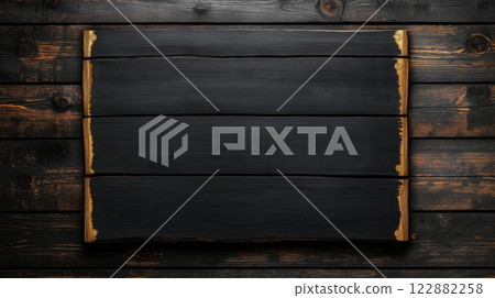 Rustic black wooden sign on weathered dark wood background 122882258
