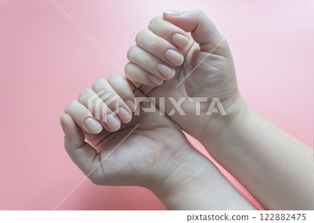 Female hands with short natural nails Female hands with short natural nails 122882475
