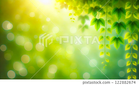 A beautiful natural background with fresh green leaves and bokeh light 122882674