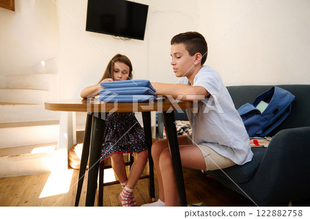 Children studying together at home Children studying together at home 122882758