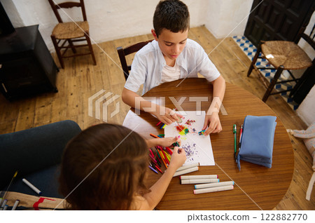 Children Engaged in Colorful Drawing Children Engaged in Colorful Drawing 122882770