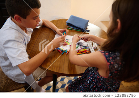 Kids creating art at the table Kids creating art at the table 122882786