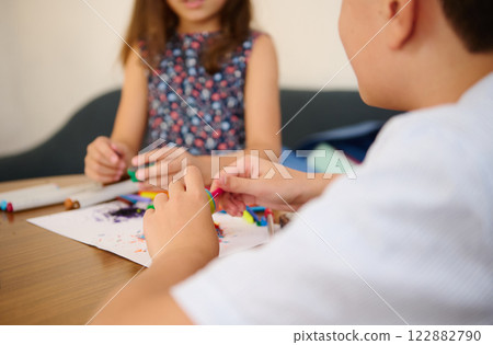 Children crafting at the table 122882790