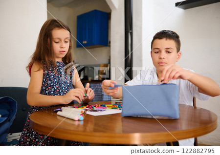Children doing crafts together indoors Children doing crafts together indoors 122882795