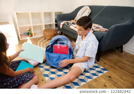 Children organizing stationery at home Children organizing stationery at home 122882842