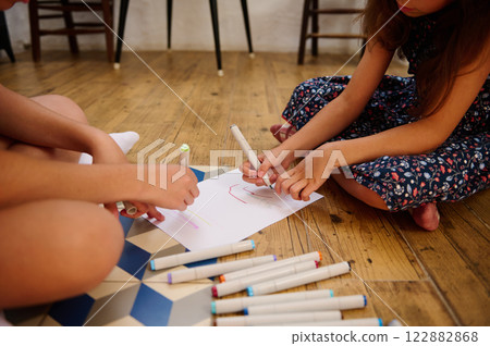 Children Coloring on Paper Together 122882868