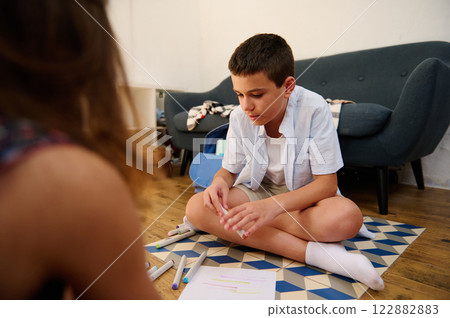 Child creating artwork at home Child creating artwork at home 122882883