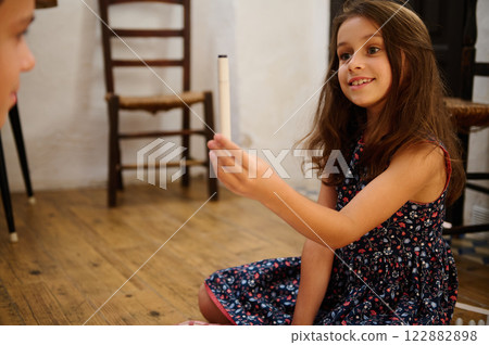 Smiling girl holding marker pen Smiling girl holding marker pen 122882898