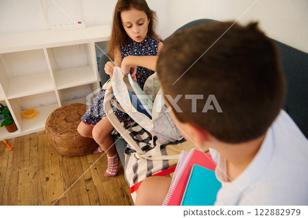 Children organizing their school supplies 122882979
