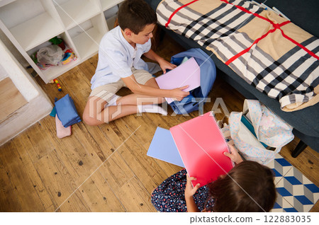 Children preparing school supplies Children preparing school supplies 122883035