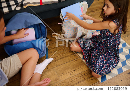 Children Packing Backpacks at Home Children Packing Backpacks at Home 122883039