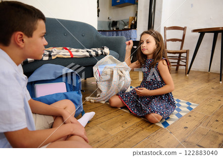 Children Interacting in a Cozy Room Children Interacting in a Cozy Room 122883040